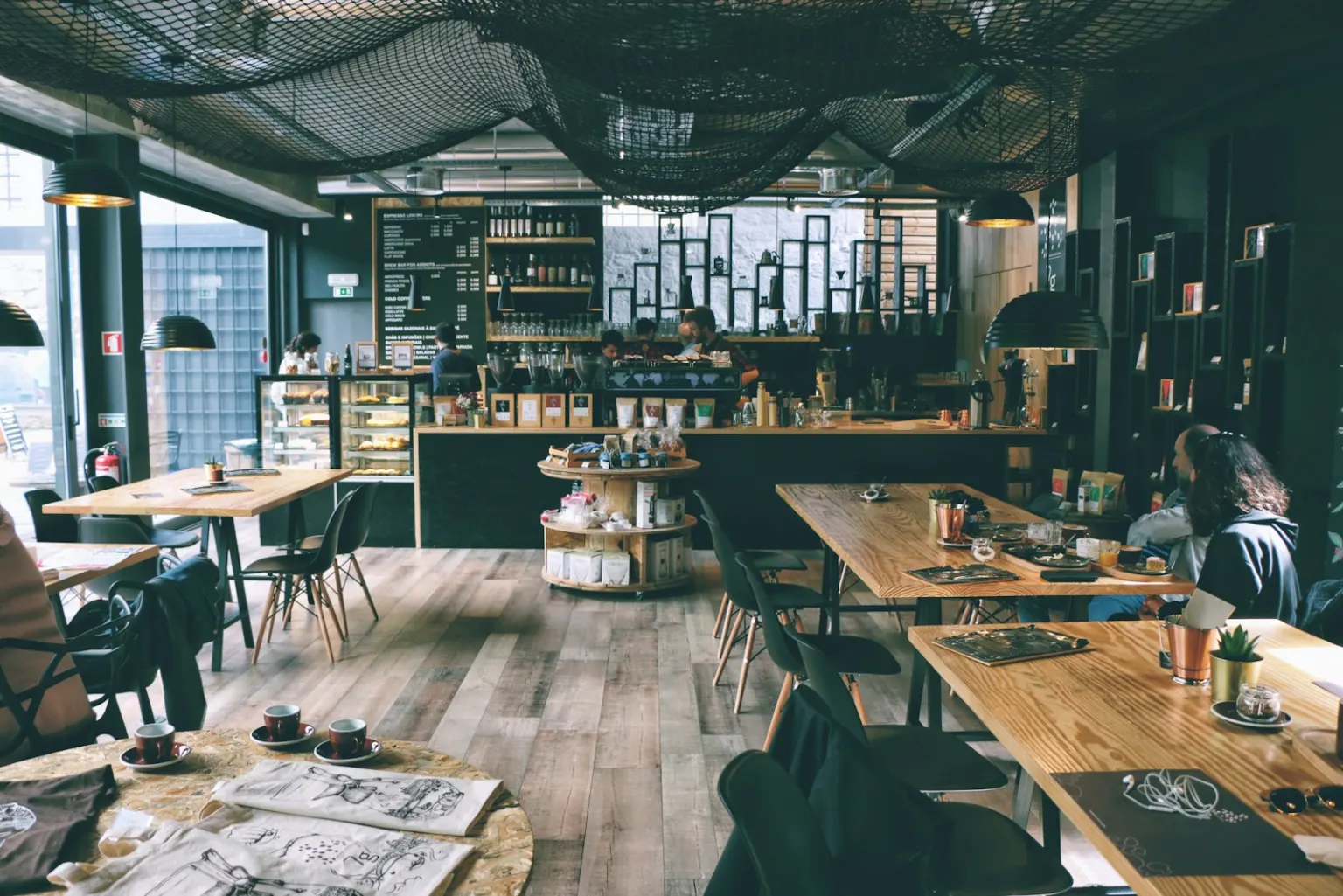 A new café owner at work behind the machine