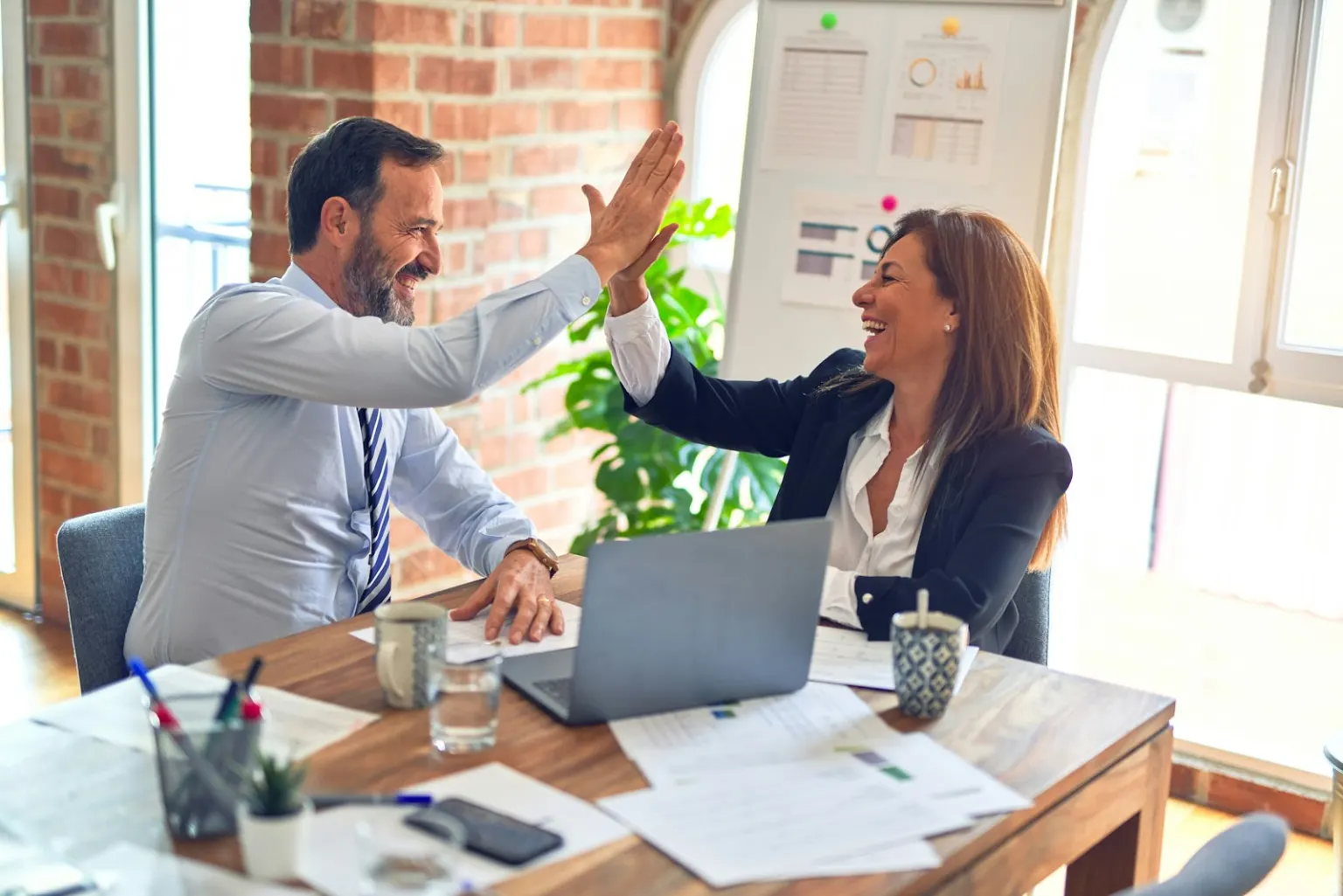 Two people going through a website plan together